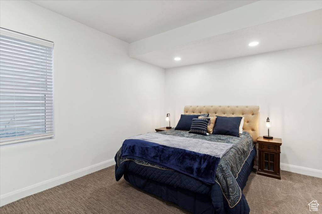 Bedroom featuring carpet flooring, recessed lighting, and multiple windows