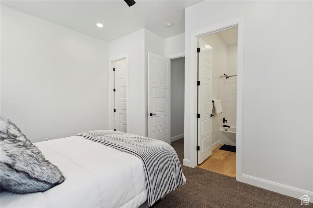 Carpeted bedroom with recessed lighting, ensuite bath, and a ceiling fan