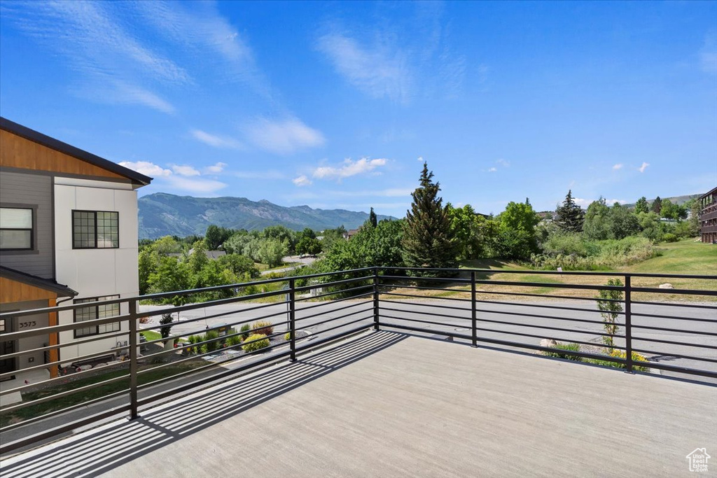 Wooden terrace featuring a mountain view