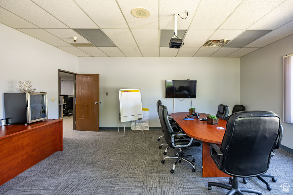 Office space featuring a paneled ceiling and carpet floors