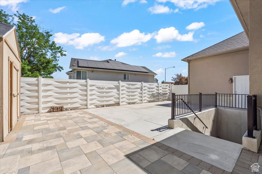 Fenced backyard with a patio