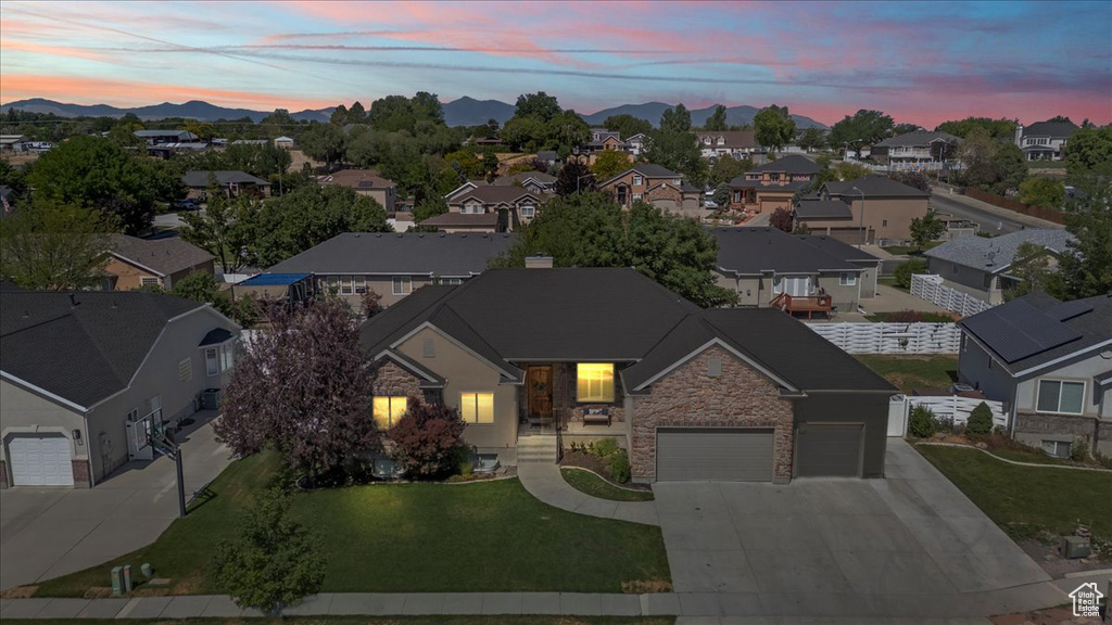 Aerial view at dusk of a residential view and a mountain view