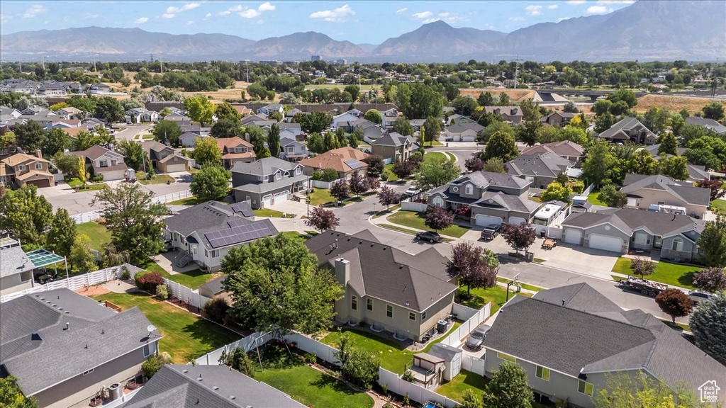Aerial view of residential area featuring a mountain backdrop