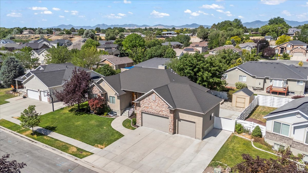 Aerial view of residential area featuring a mountain backdrop