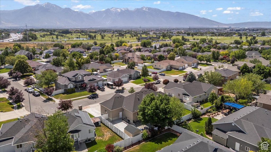 Aerial perspective of suburban area with a mountain backdrop