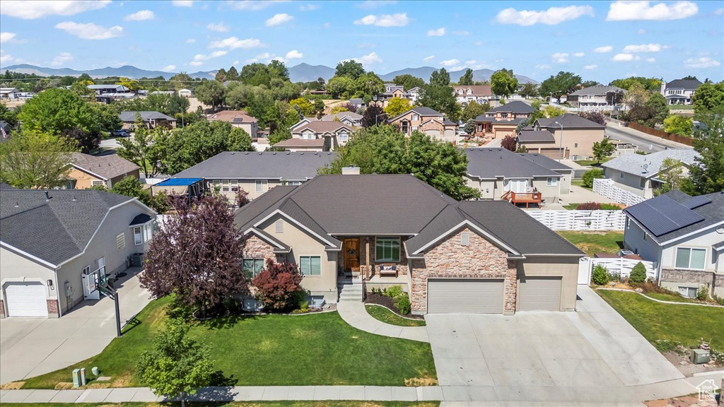 Aerial perspective of suburban area with a mountainous background