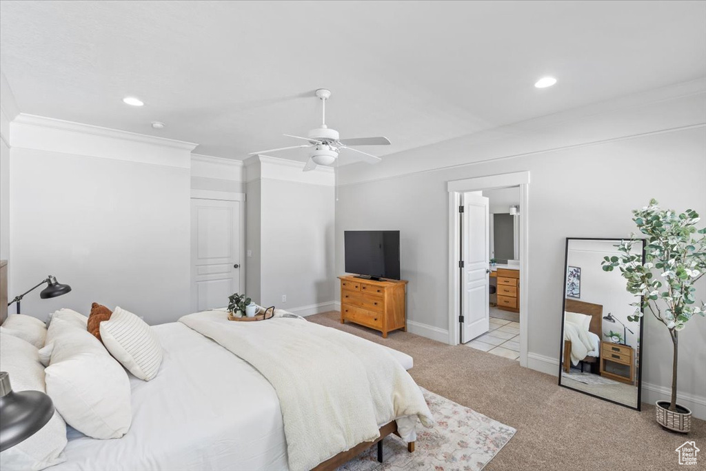 Bedroom with light colored carpet, recessed lighting, ensuite bathroom, a ceiling fan, and crown molding