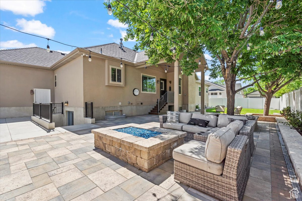 View of patio / terrace featuring an outdoor living space with a fire pit