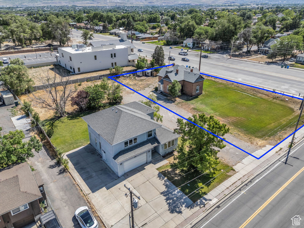 View of property location featuring property parcel outlined and a tree filled landscape