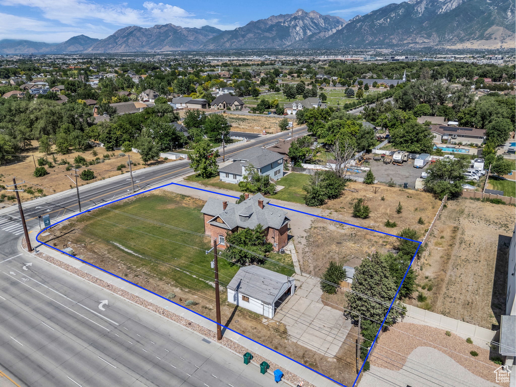 Aerial view of residential area with property boundaries highlighted