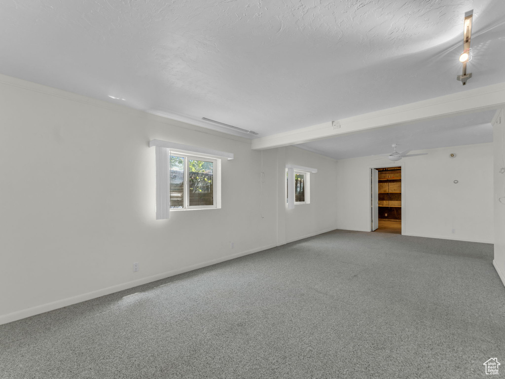 Empty room with carpet flooring and baseboards