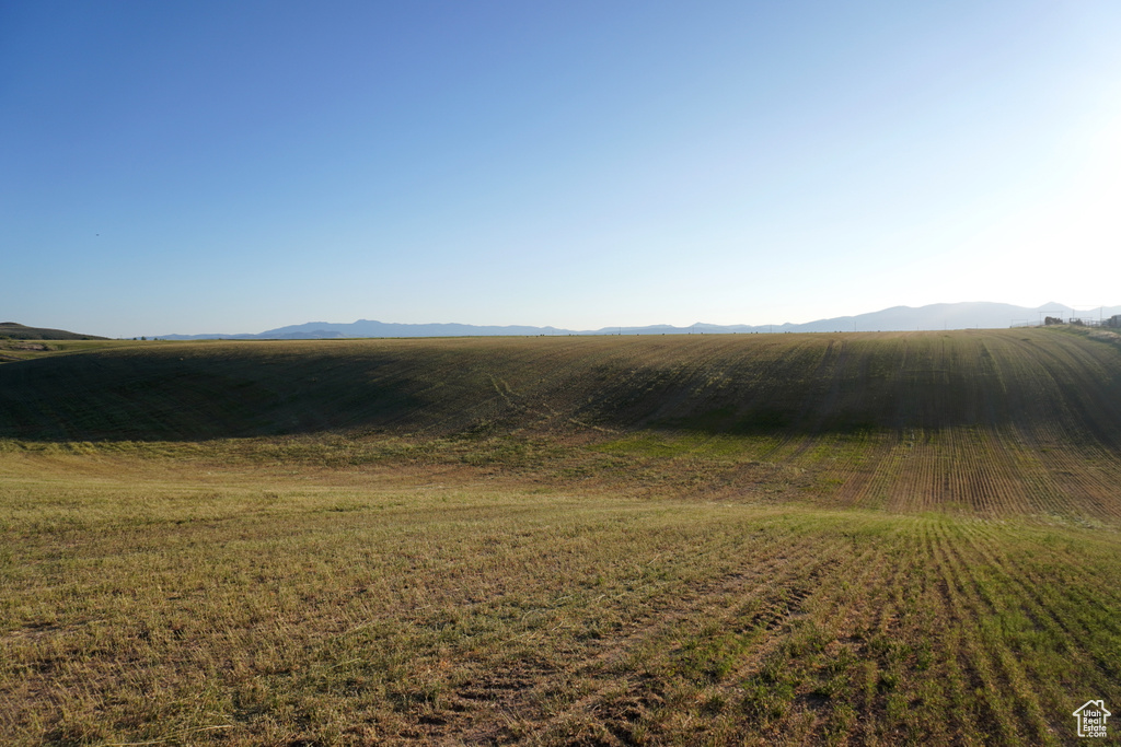 View of mountain backdrop featuring rural landscape