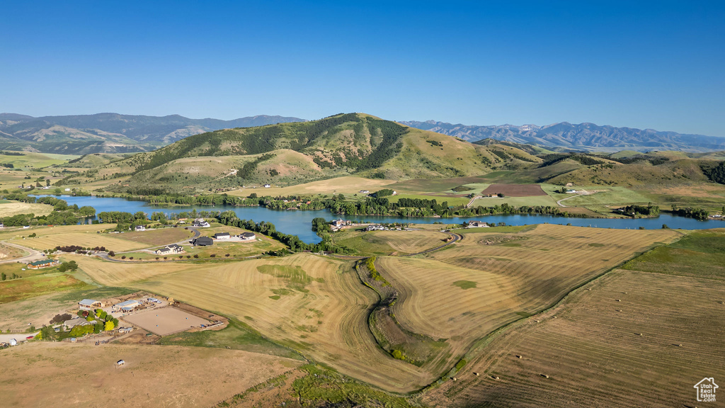 Aerial overview of property's location with a water and mountain view