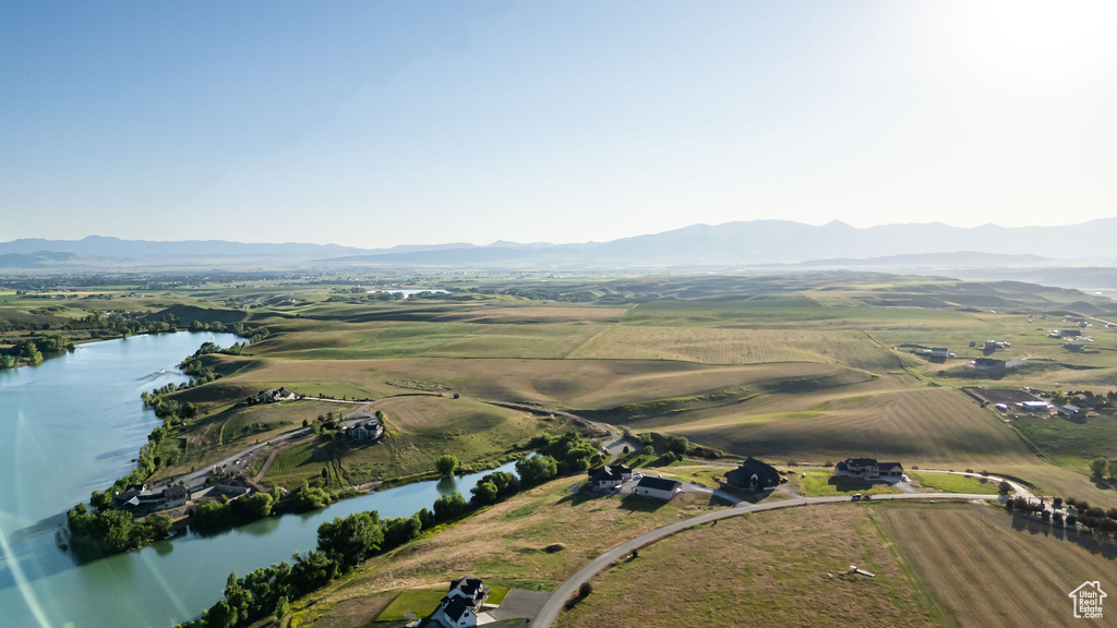 Aerial view of property's location featuring a water and mountain view and rural landscape