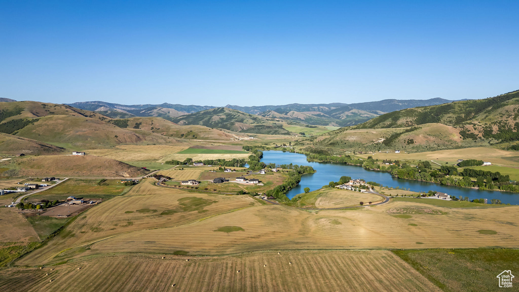 Aerial overview of property's location featuring a water and mountain view