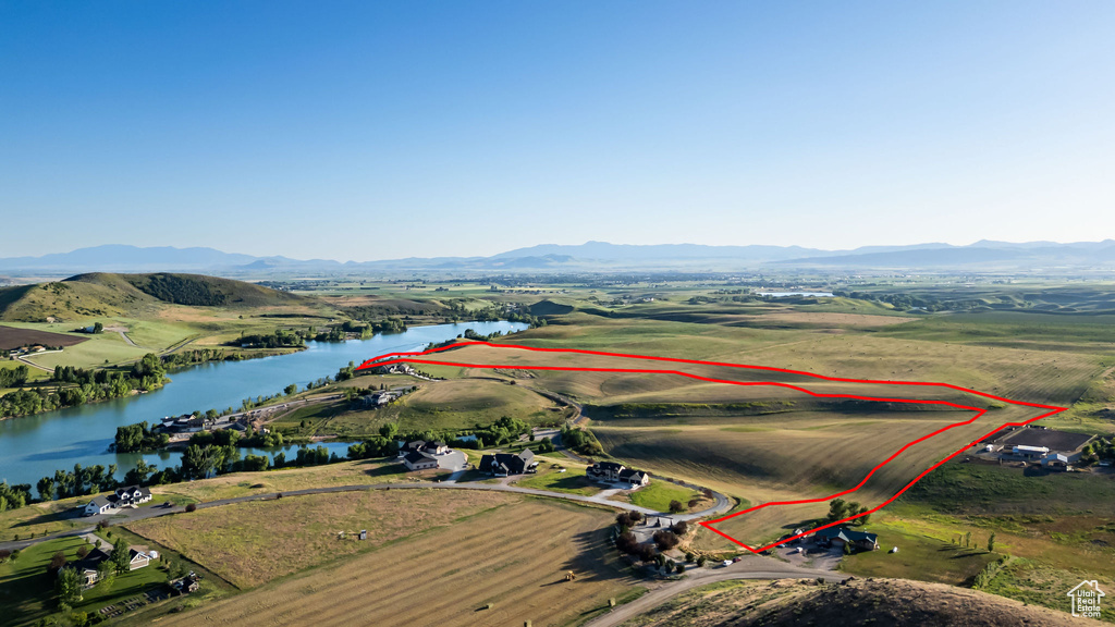View of property location with a water and mountain view and property parcel outlined