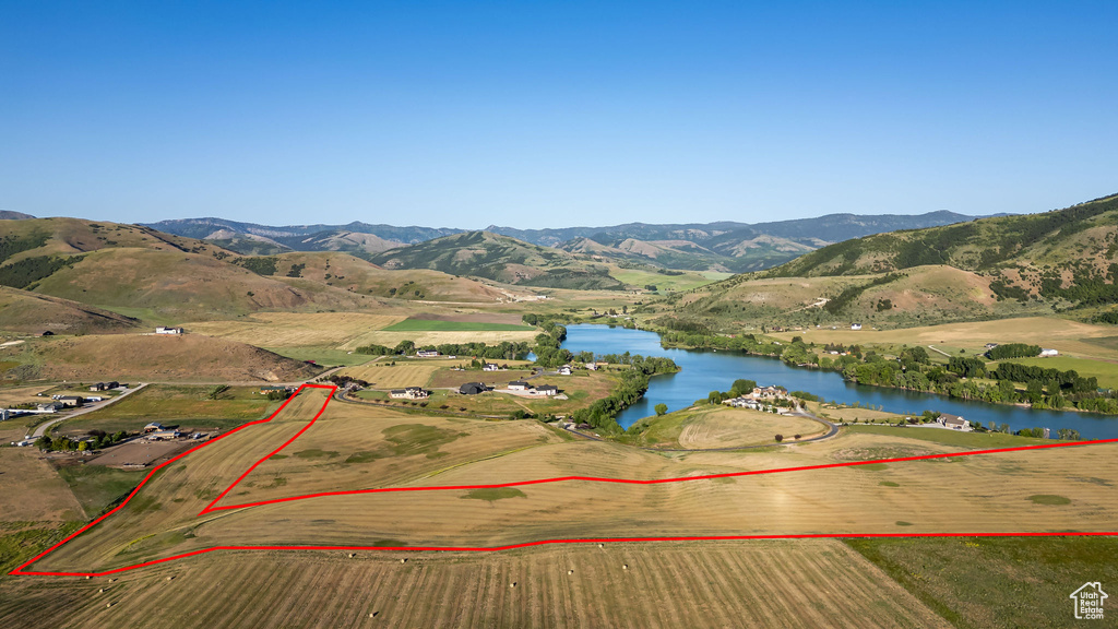 View of property location featuring a water and mountain view and property boundaries highlighted