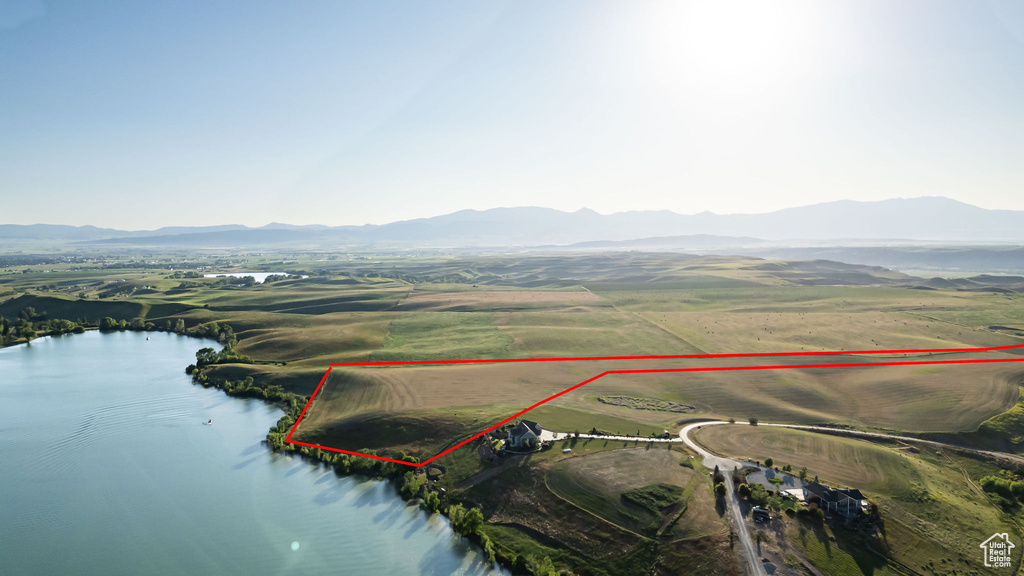 Aerial overview of property's location featuring a water and mountain view and property boundaries highlighted