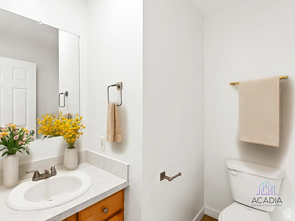 Bathroom featuring toilet and vanity