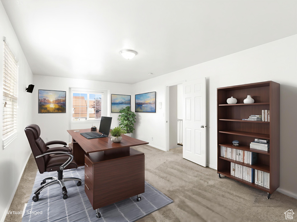 Carpeted office space with baseboards