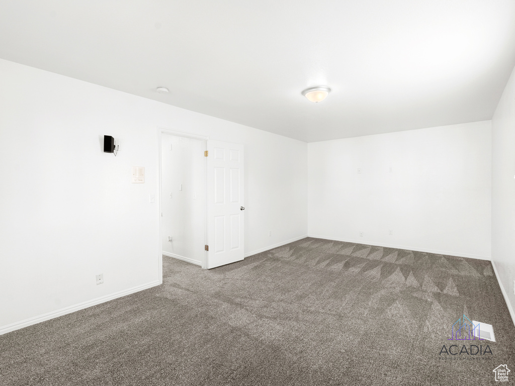 Spare room with carpet floors and baseboards