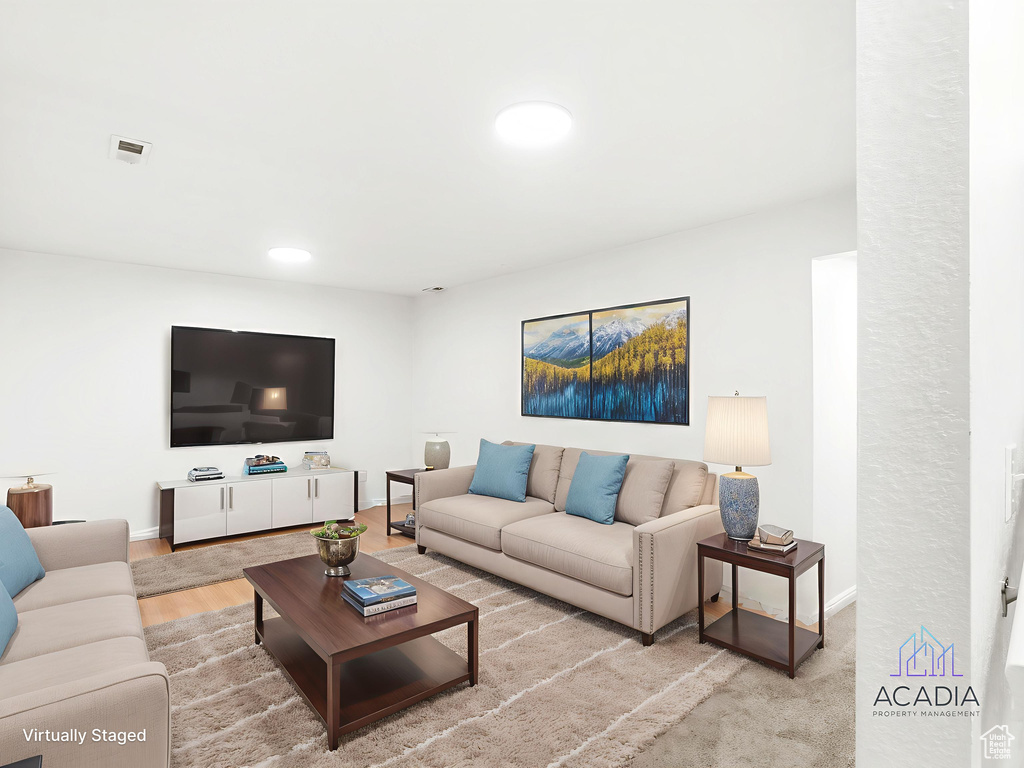 Living room featuring baseboards and wood finished floors