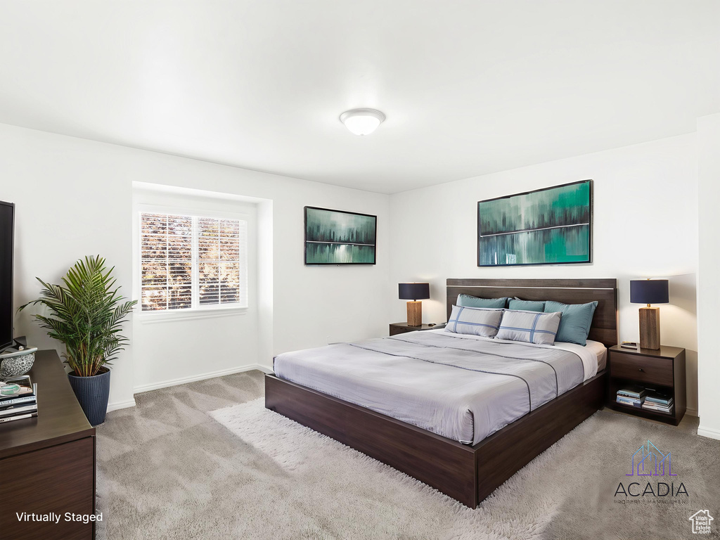 Carpeted bedroom featuring baseboards