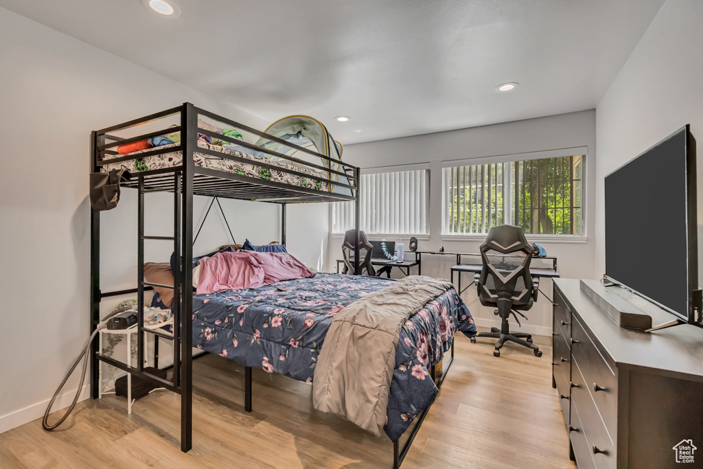 Bedroom featuring wood finished floors and recessed lighting