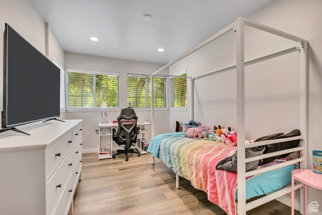 Bedroom with light wood-style flooring and recessed lighting