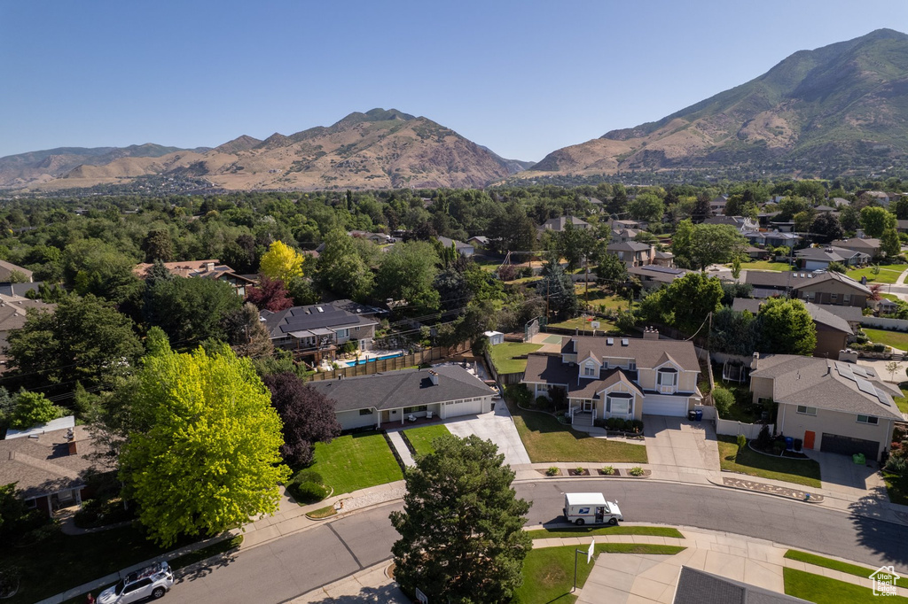 Aerial perspective of suburban area featuring a mountain backdrop