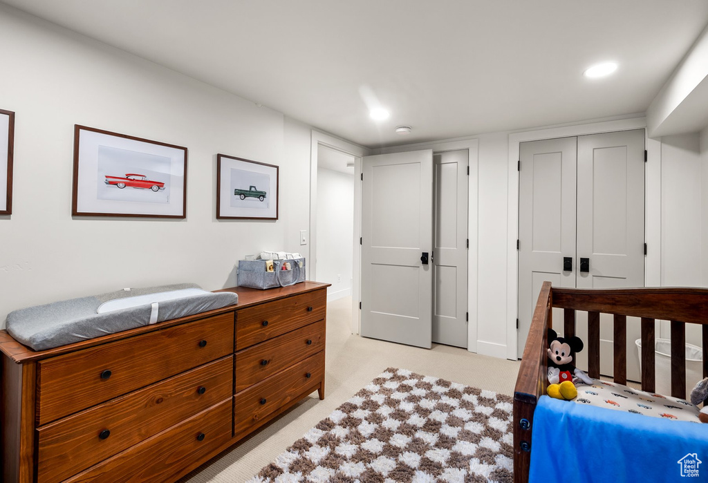 Bedroom with recessed lighting and a closet