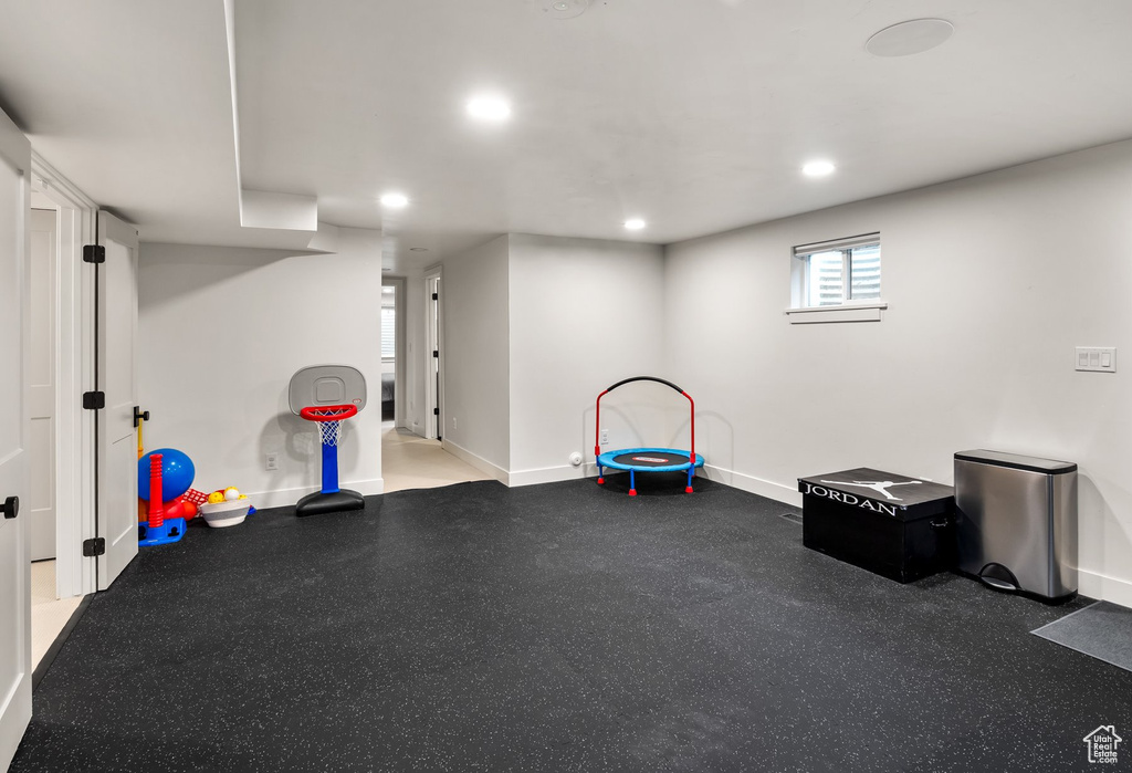 Game room featuring rubber floors and recessed lighting