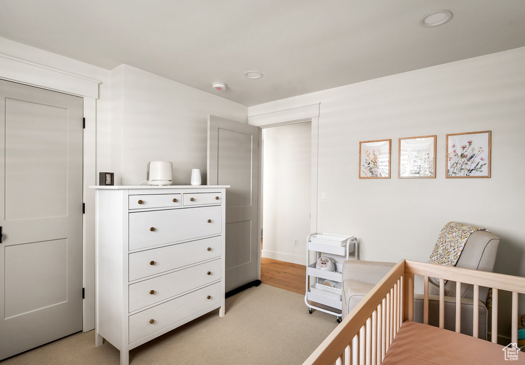 Bedroom featuring light carpet and recessed lighting