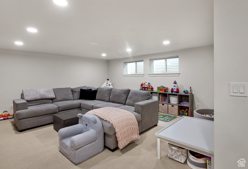 Carpeted living room featuring recessed lighting