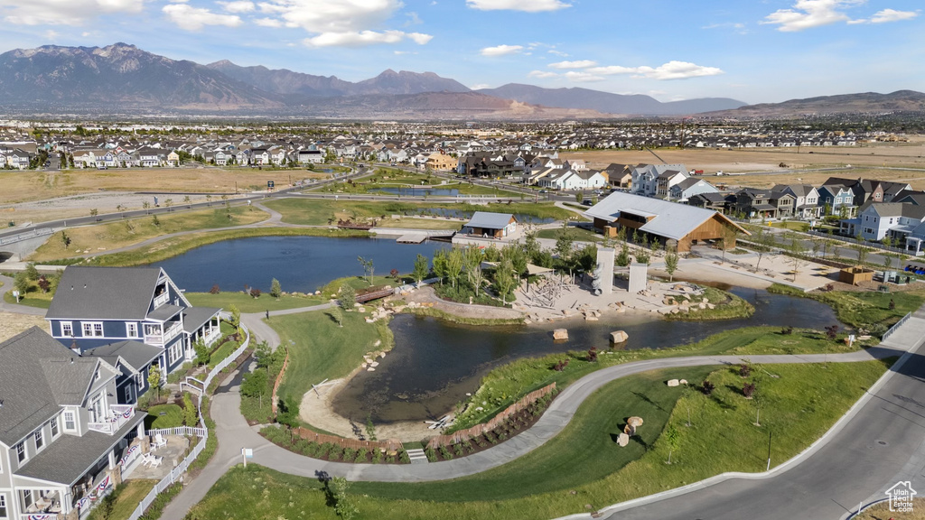 View of property location featuring nearby suburban area and a water and mountain view