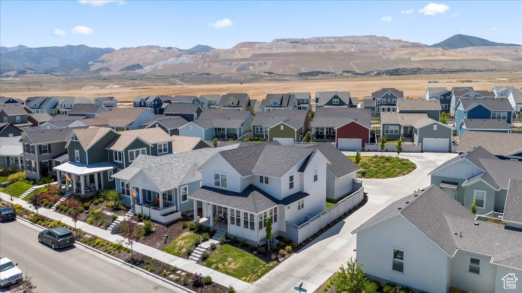 Aerial view of residential area with a mountainous background