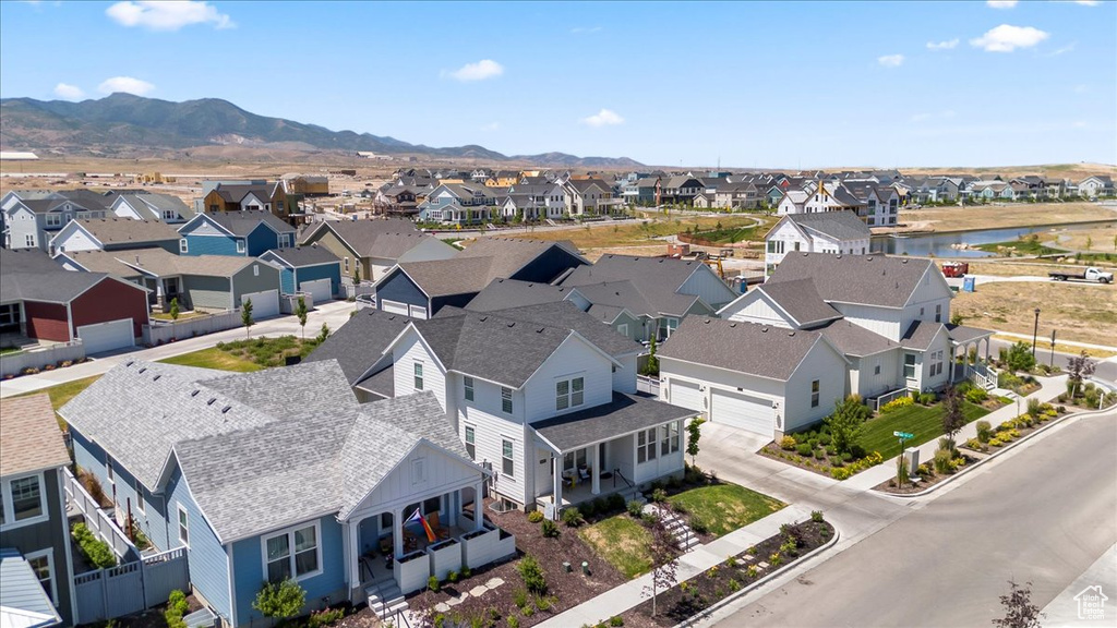 Aerial view of residential area featuring a mountain backdrop