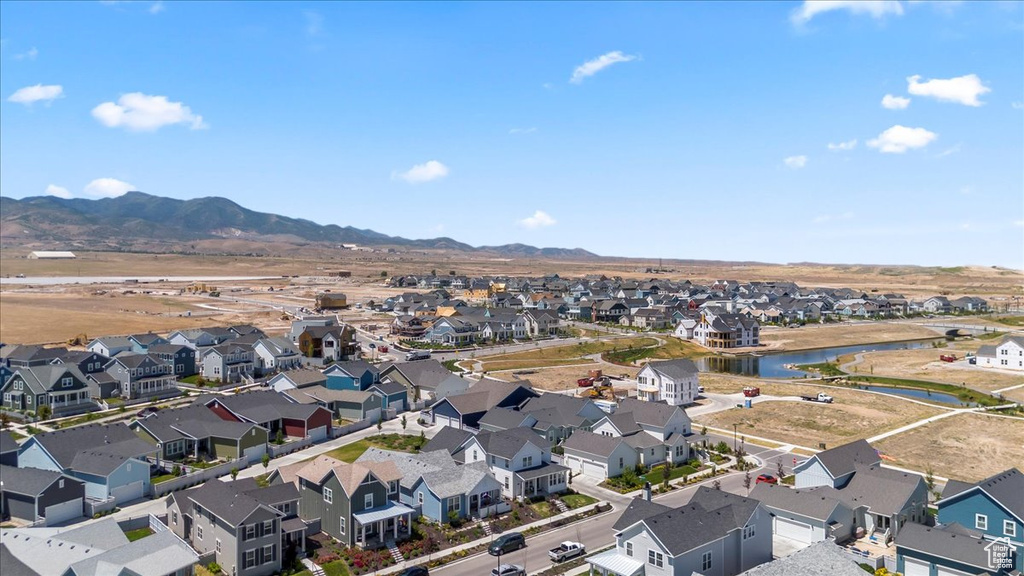 Aerial perspective of suburban area with a water and mountain view