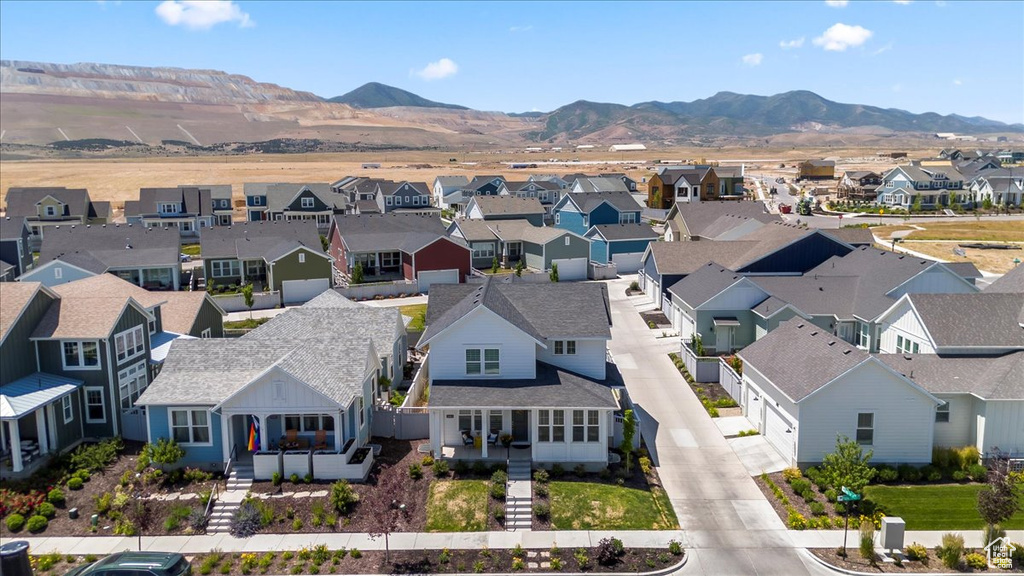 Aerial perspective of suburban area with a mountain backdrop
