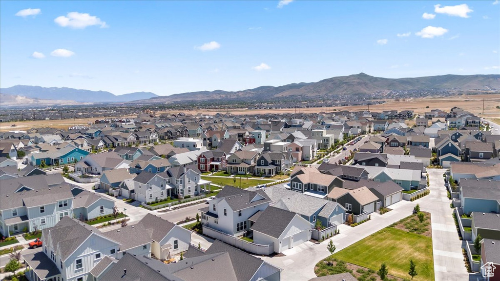 Aerial perspective of suburban area with a mountainous background