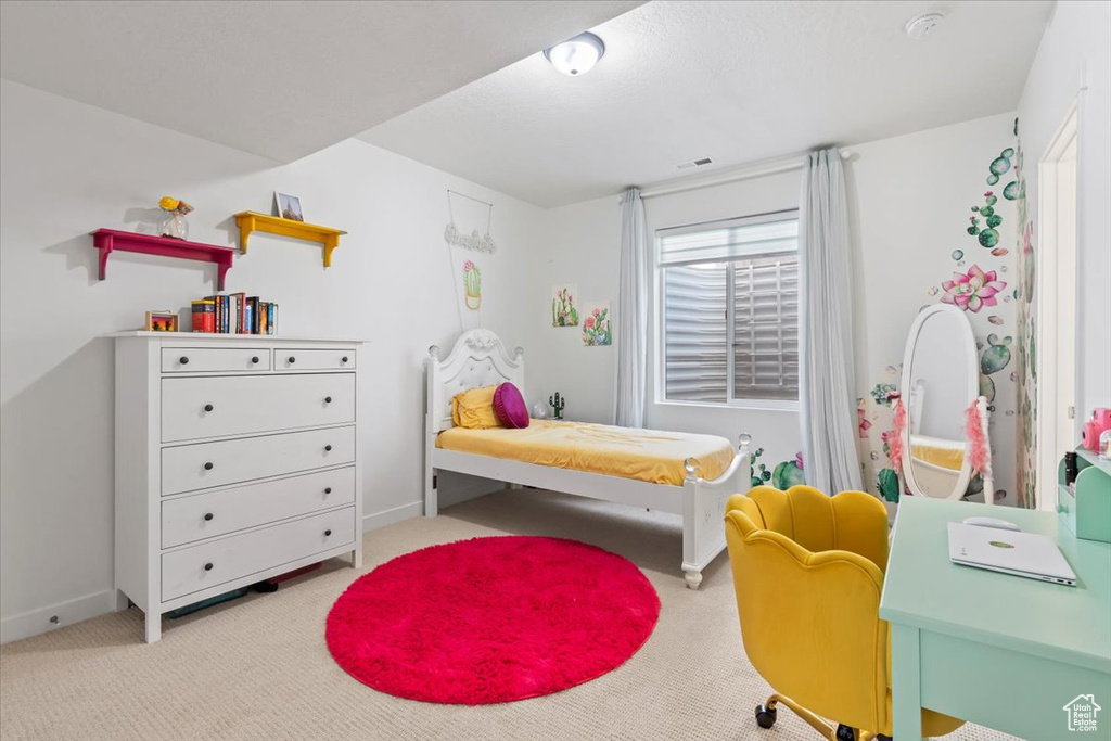 Bedroom with carpet floors and baseboards