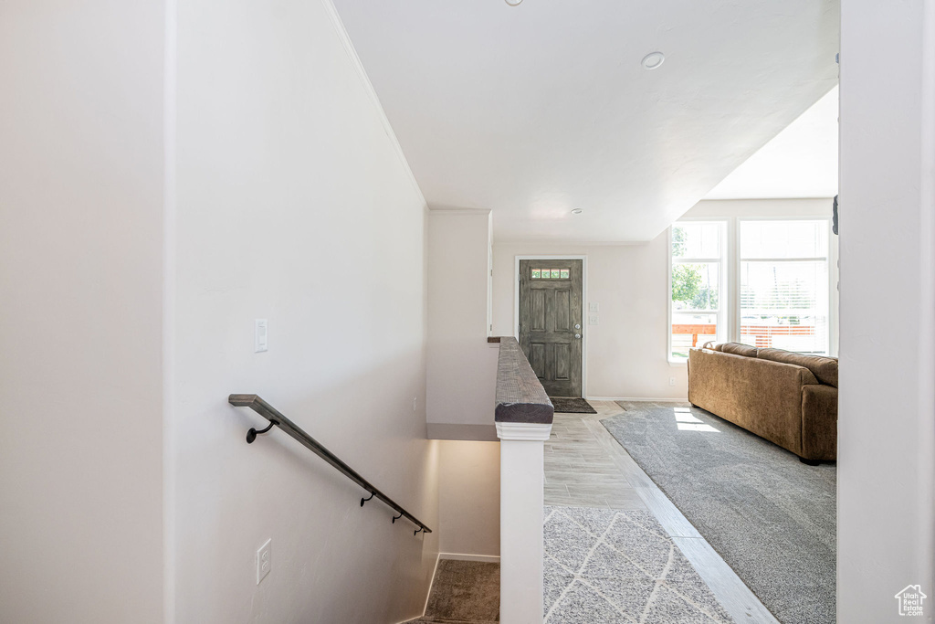 Entryway featuring baseboards and light wood finished floors