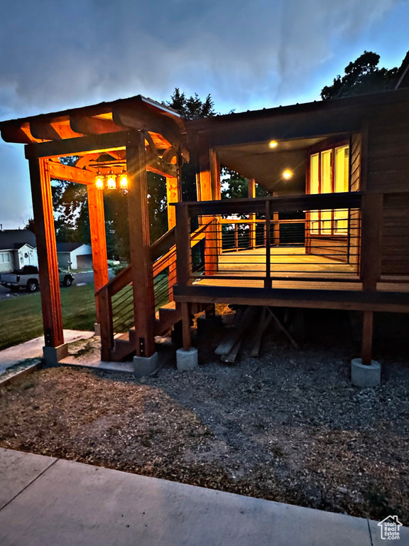 Back of house with a wooden deck