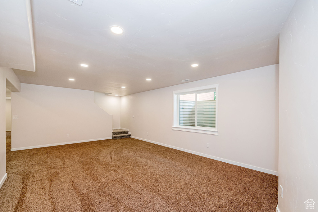 Basement with carpet floors and recessed lighting