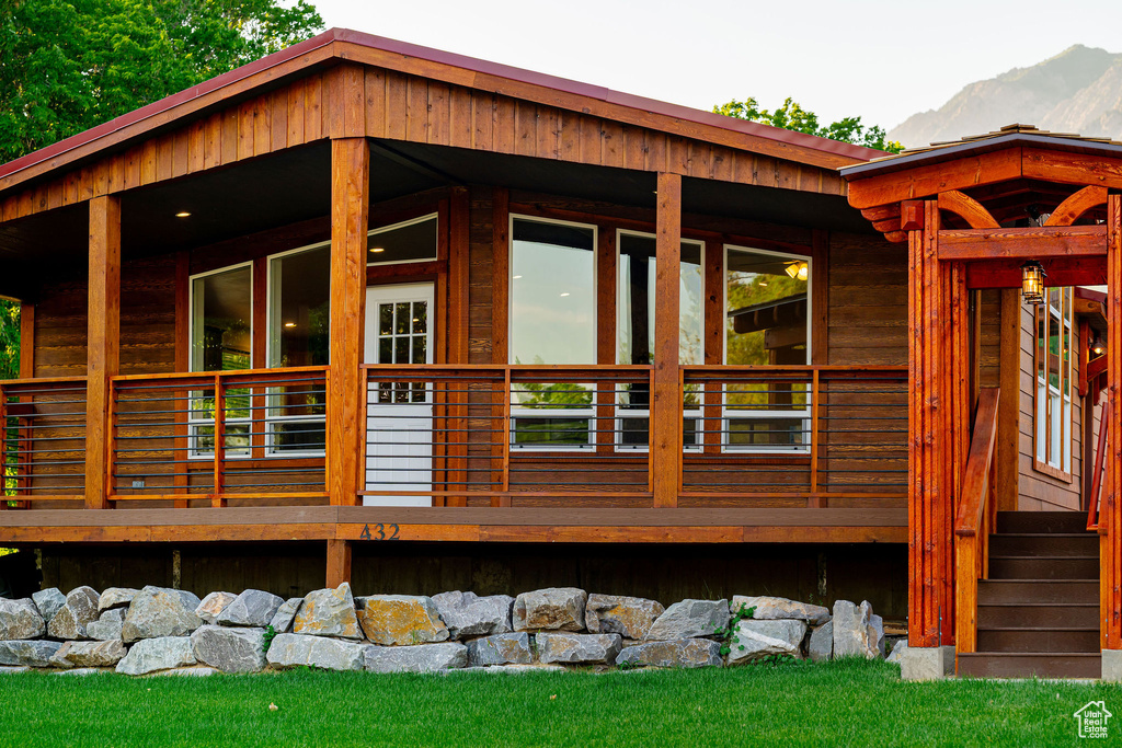Back of house featuring a mountain view