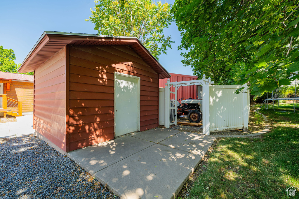 View of outbuilding with a trampoline