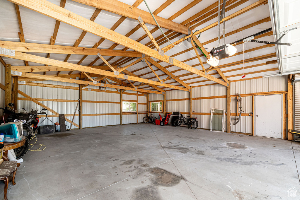 Garage with a garage door opener and metal wall