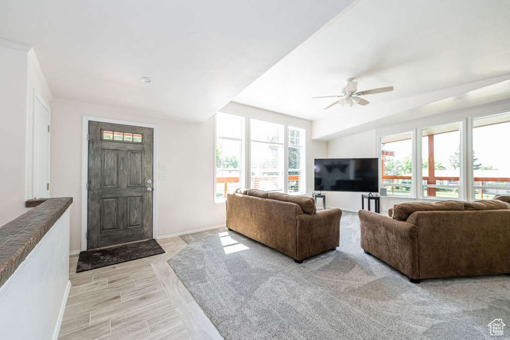 Living room with baseboards and ceiling fan