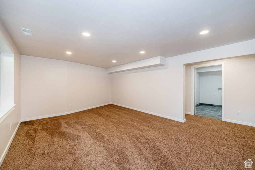 Finished below grade area featuring carpet and recessed lighting