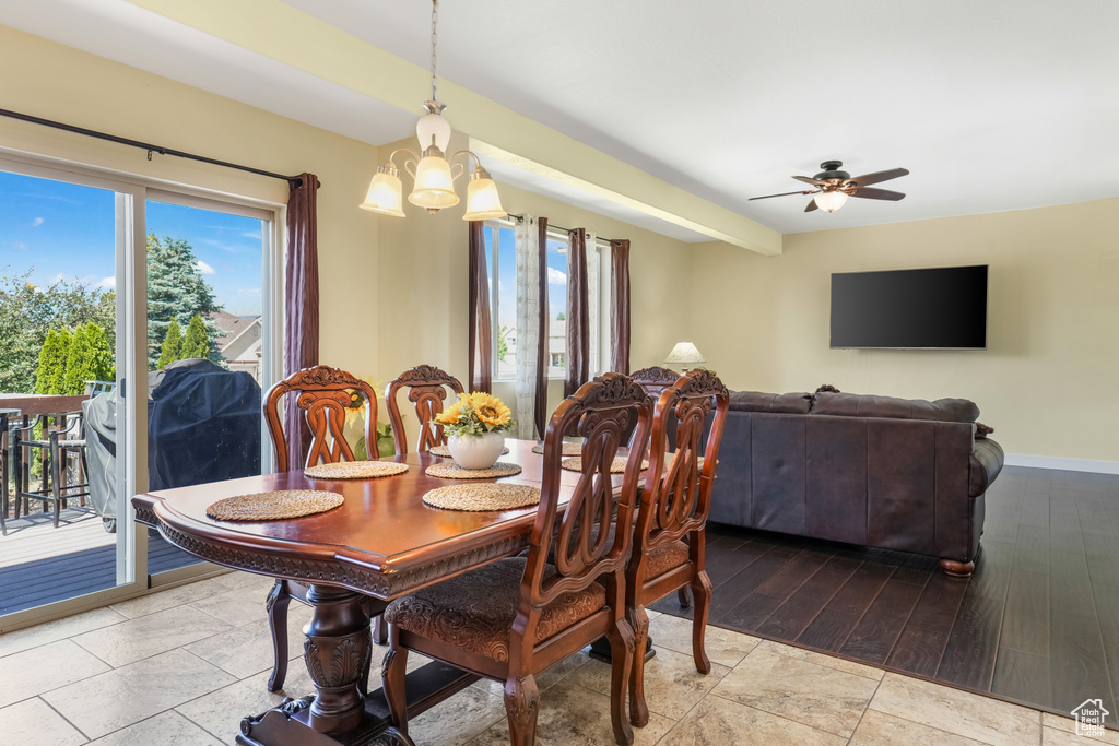 Dining room with a chandelier and ceiling fan